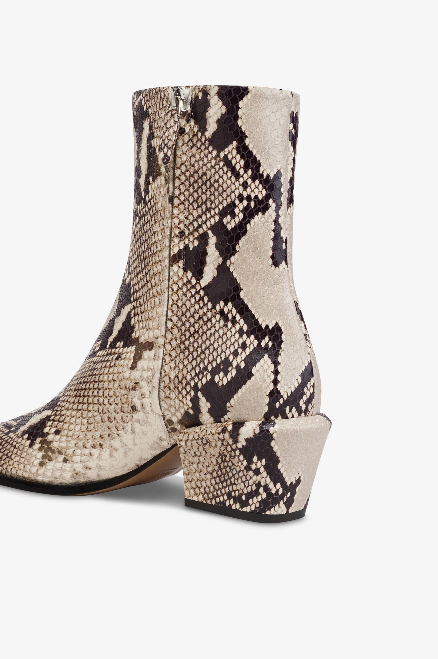Ankle boots in natural printed python leather.