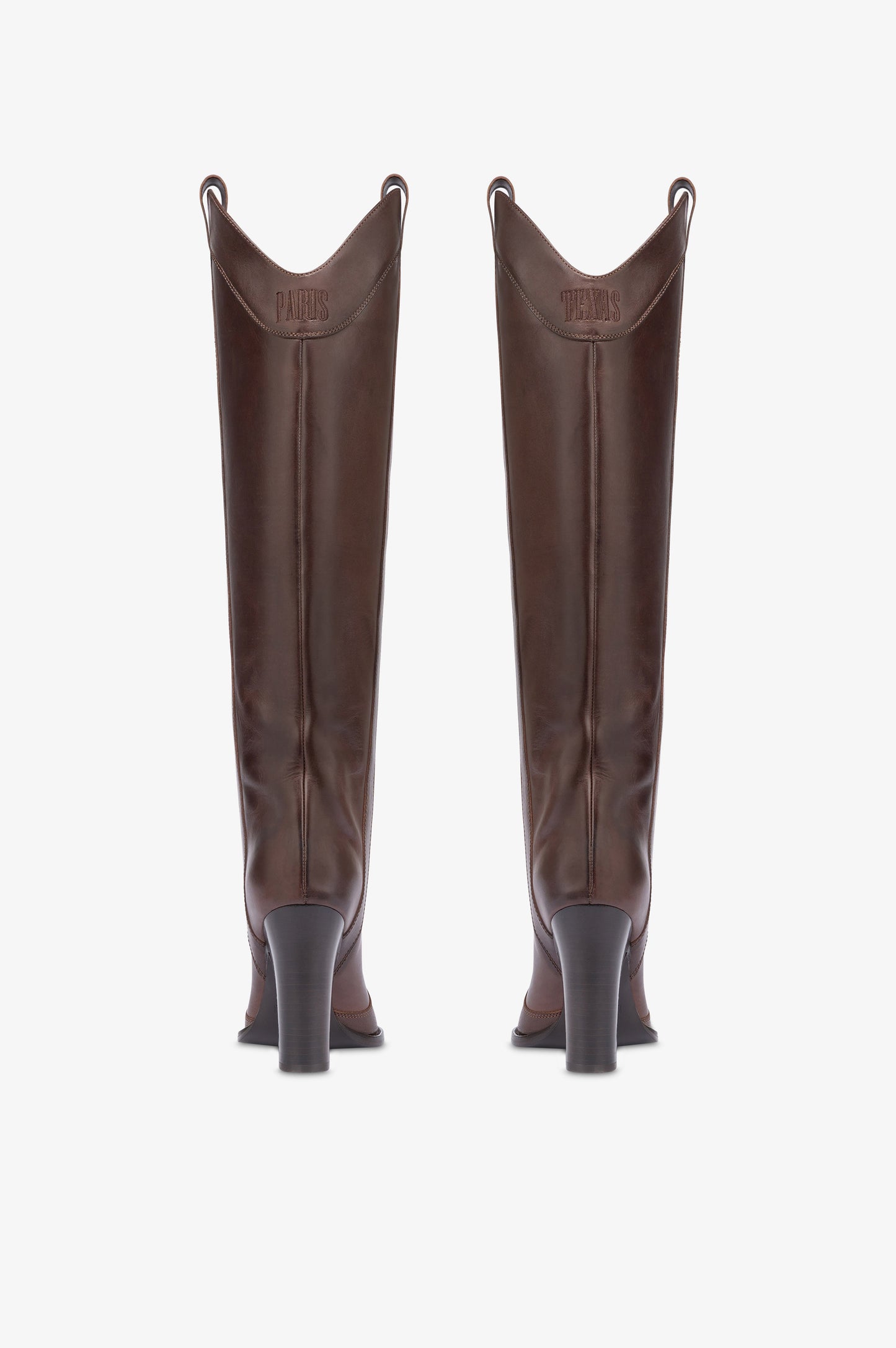 Boots in ebony calf leather.