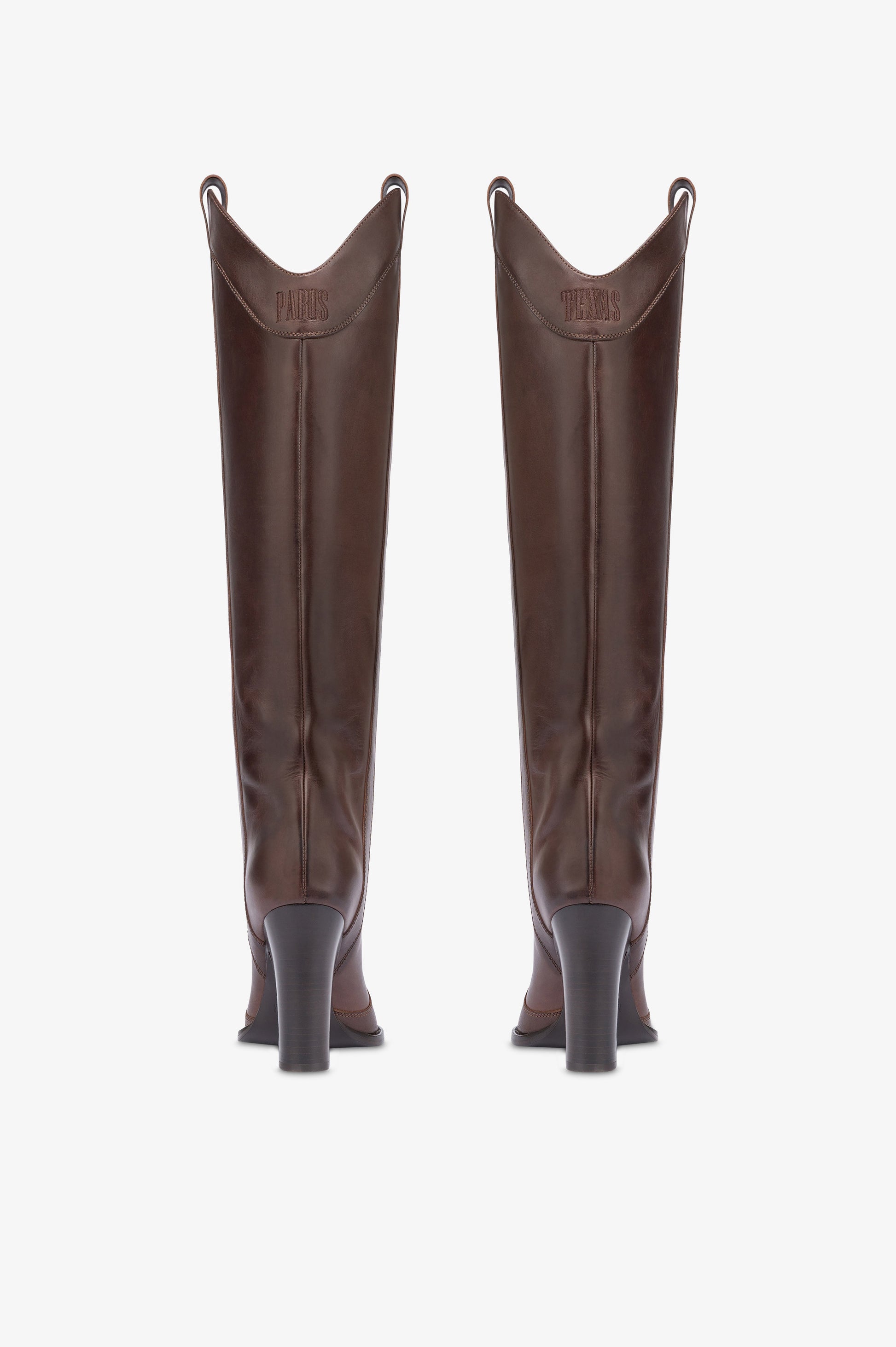 Boots in ebony calf leather.