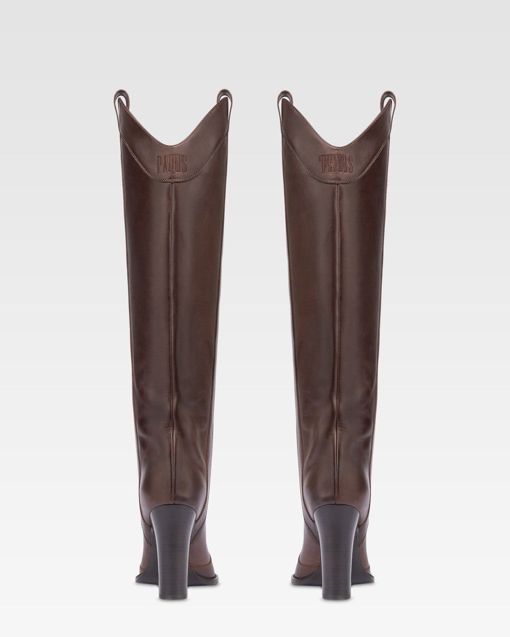 Boots in ebony calf leather.