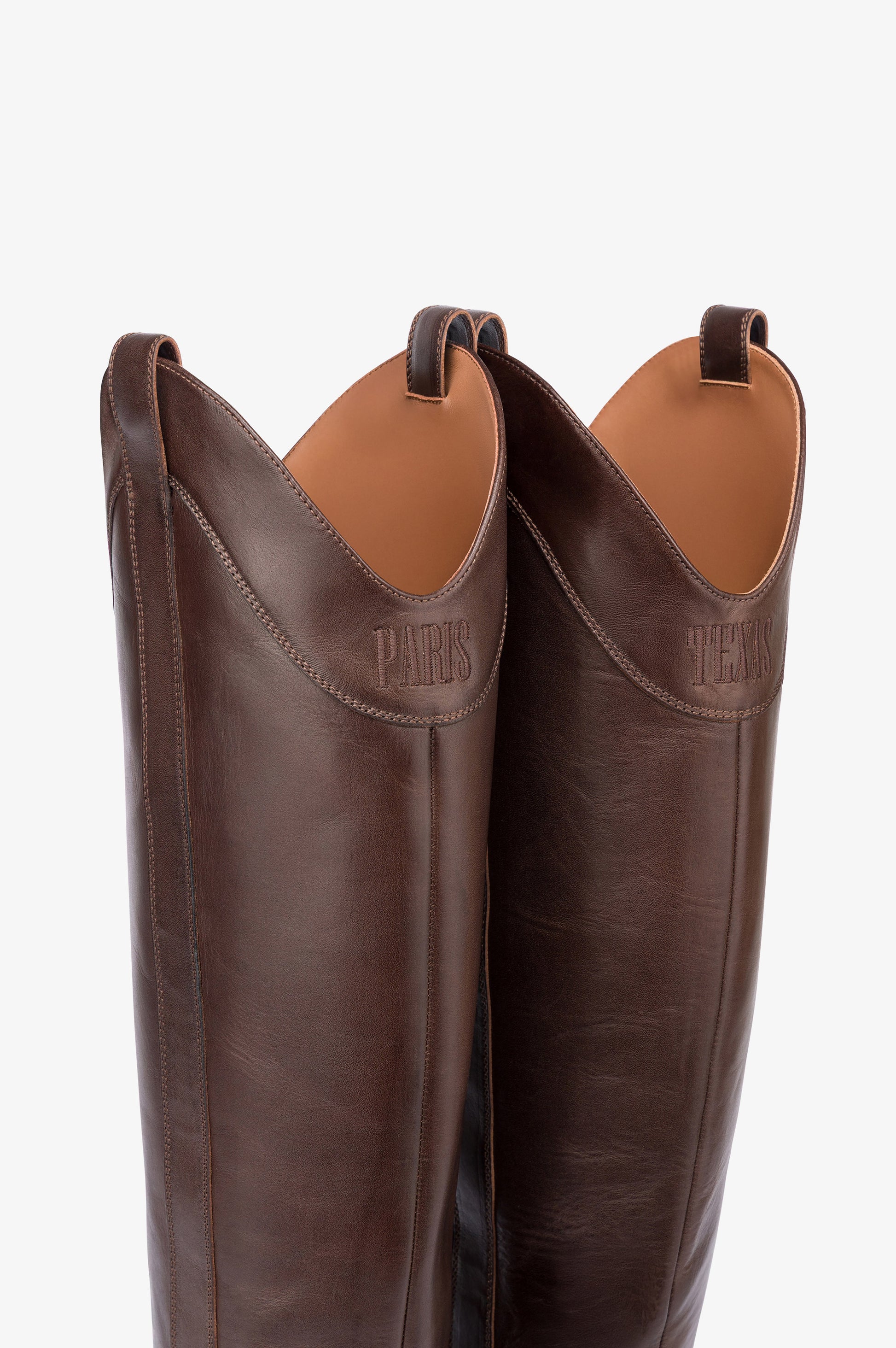 Boots in ebony calf leather.