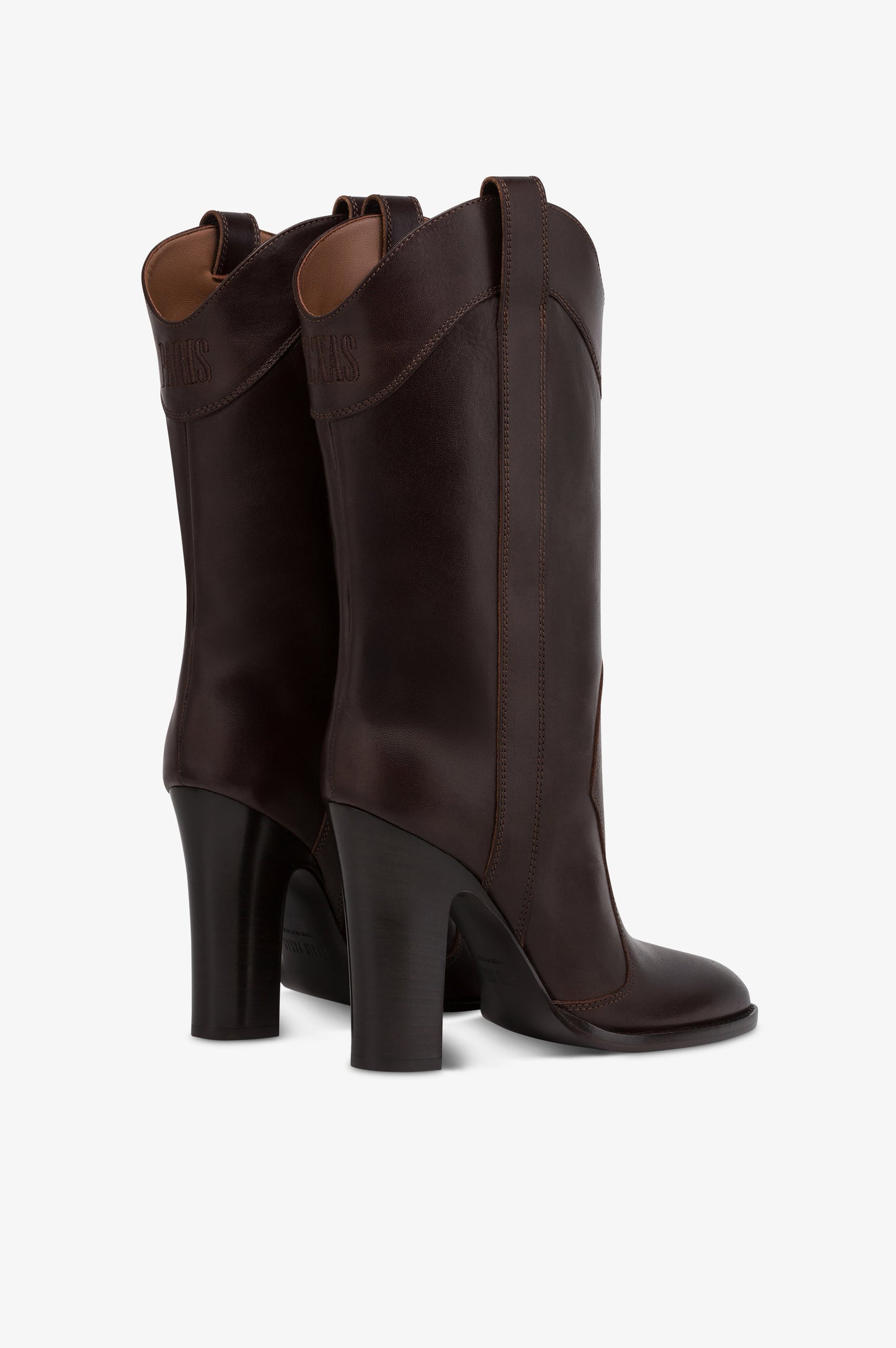 Boots in ebony calf leather.