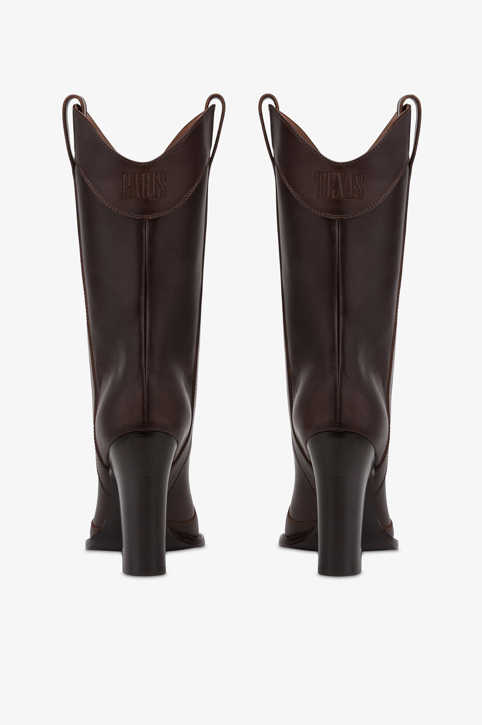 Boots in ebony calf leather.