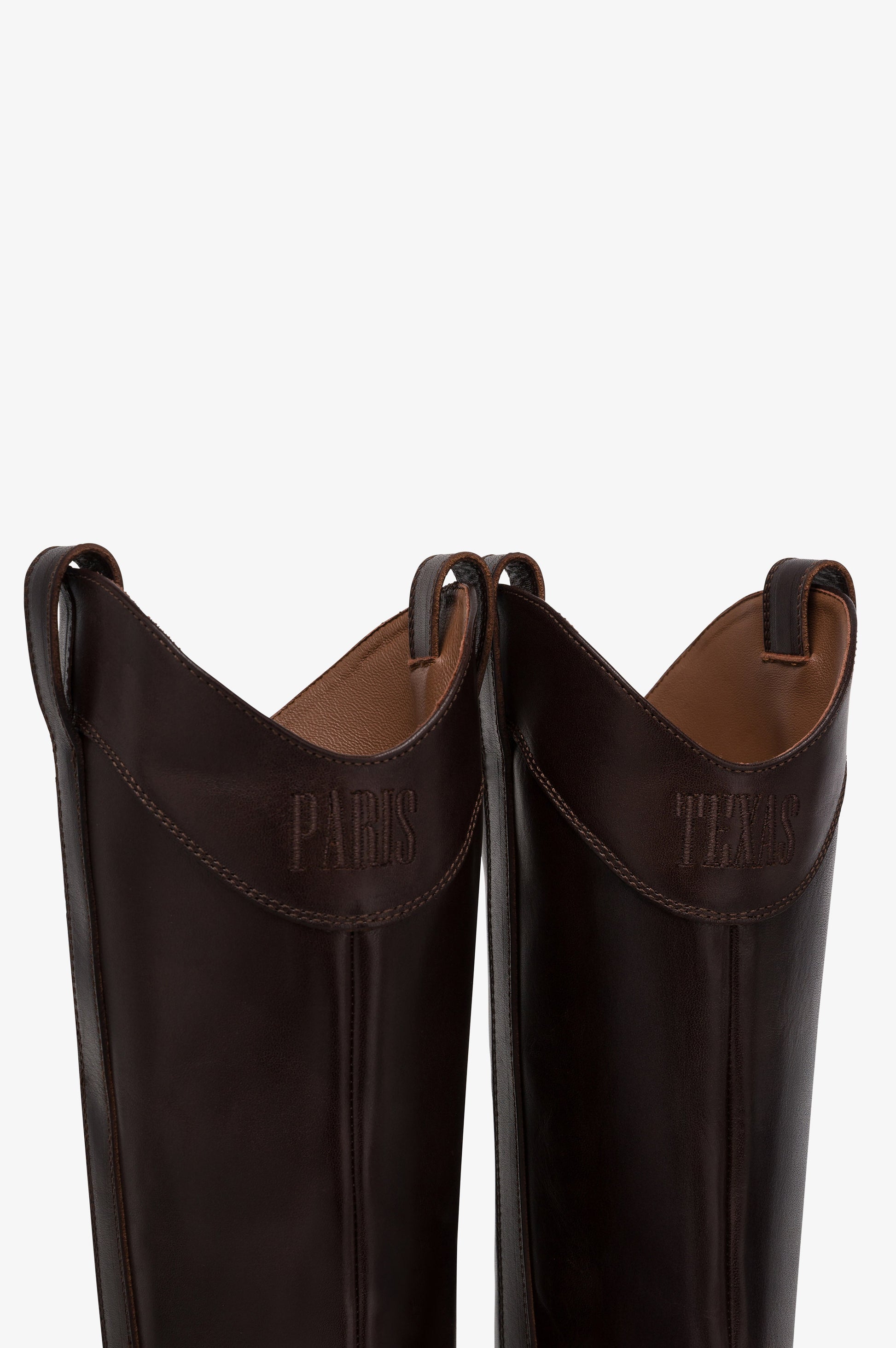 Boots in ebony calf leather.