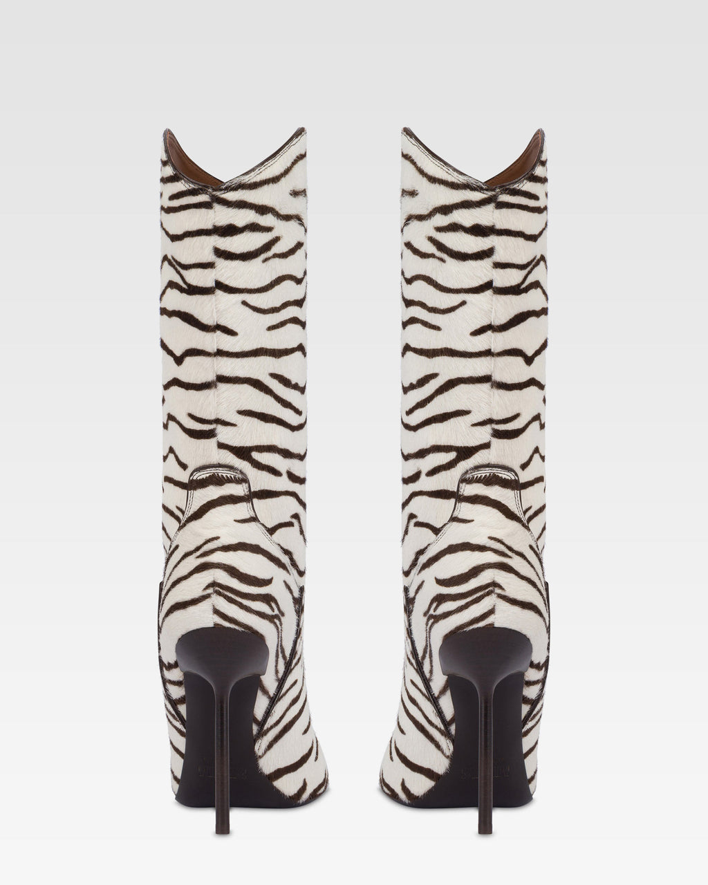 Boots in white and ebony printed cowhide.