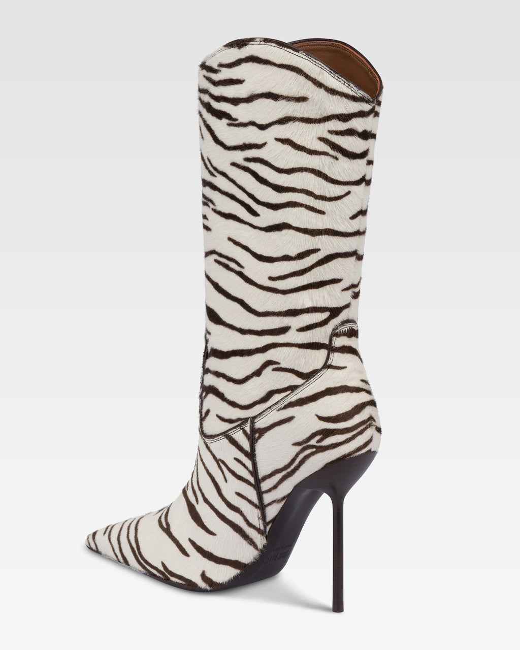 Boots in white and ebony printed cowhide.