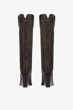 Botas tejanas de piel de efecto <<vintage>> de color negro.