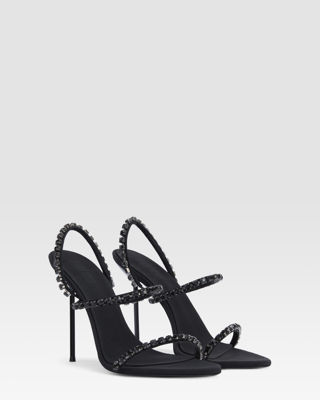 Slingback sandals in black crepe satin with stud detailing