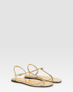 Flache Sandalen aus goldfarbenem Plissee-Leder mit Metallic-Effekt