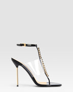 T-strap sandals in black patent leather with stud detailing