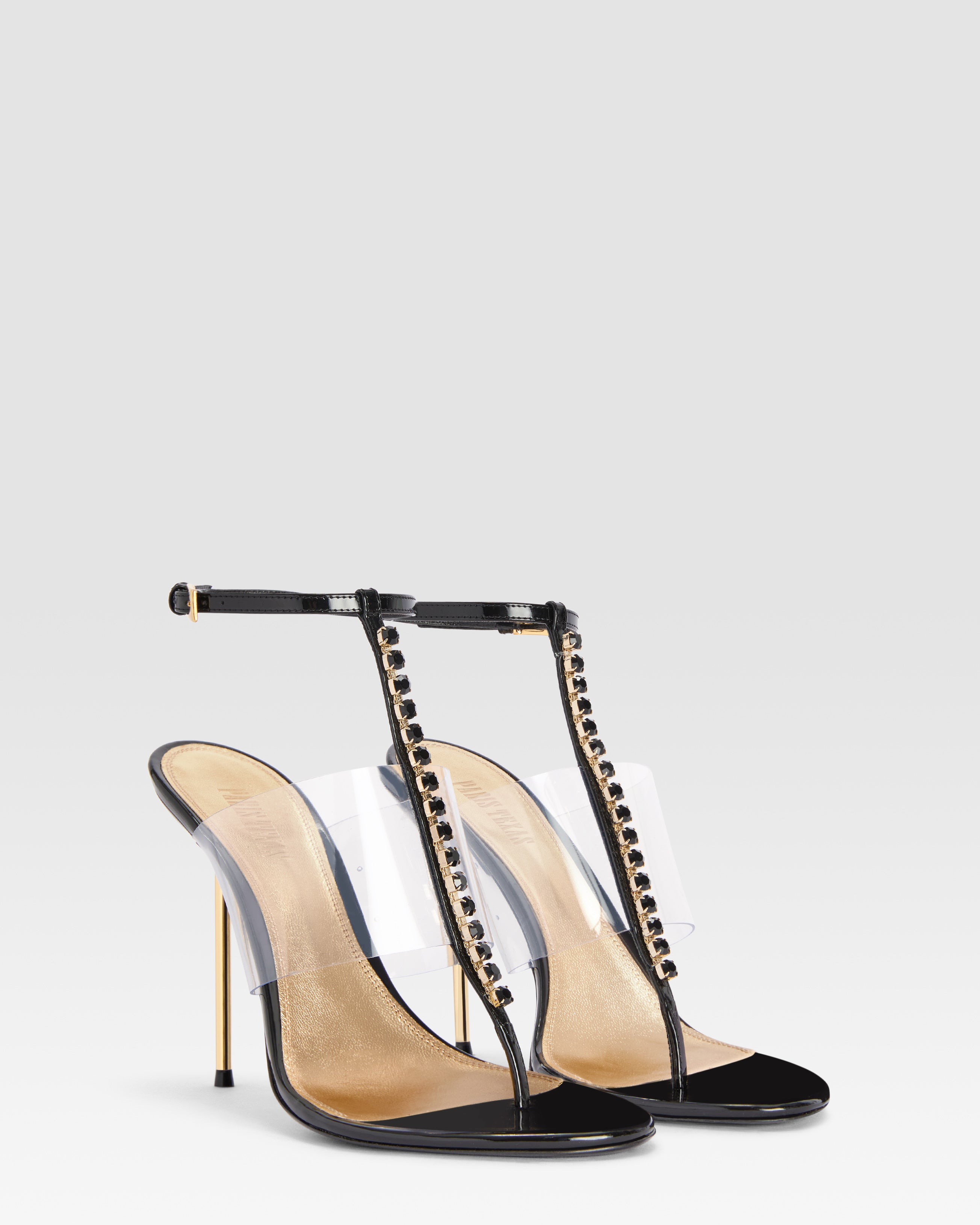 T-strap sandals in black patent leather with stud detailing