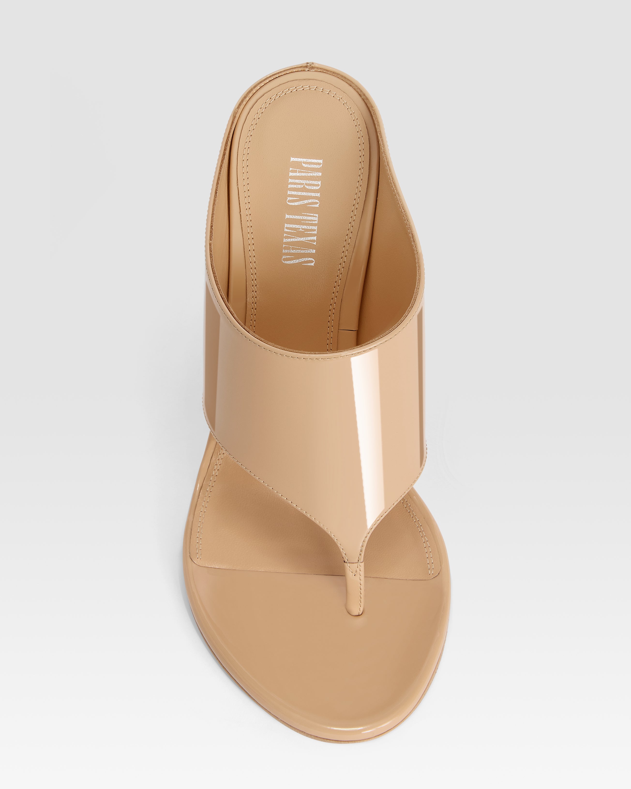 Thong mules in honey patent leather