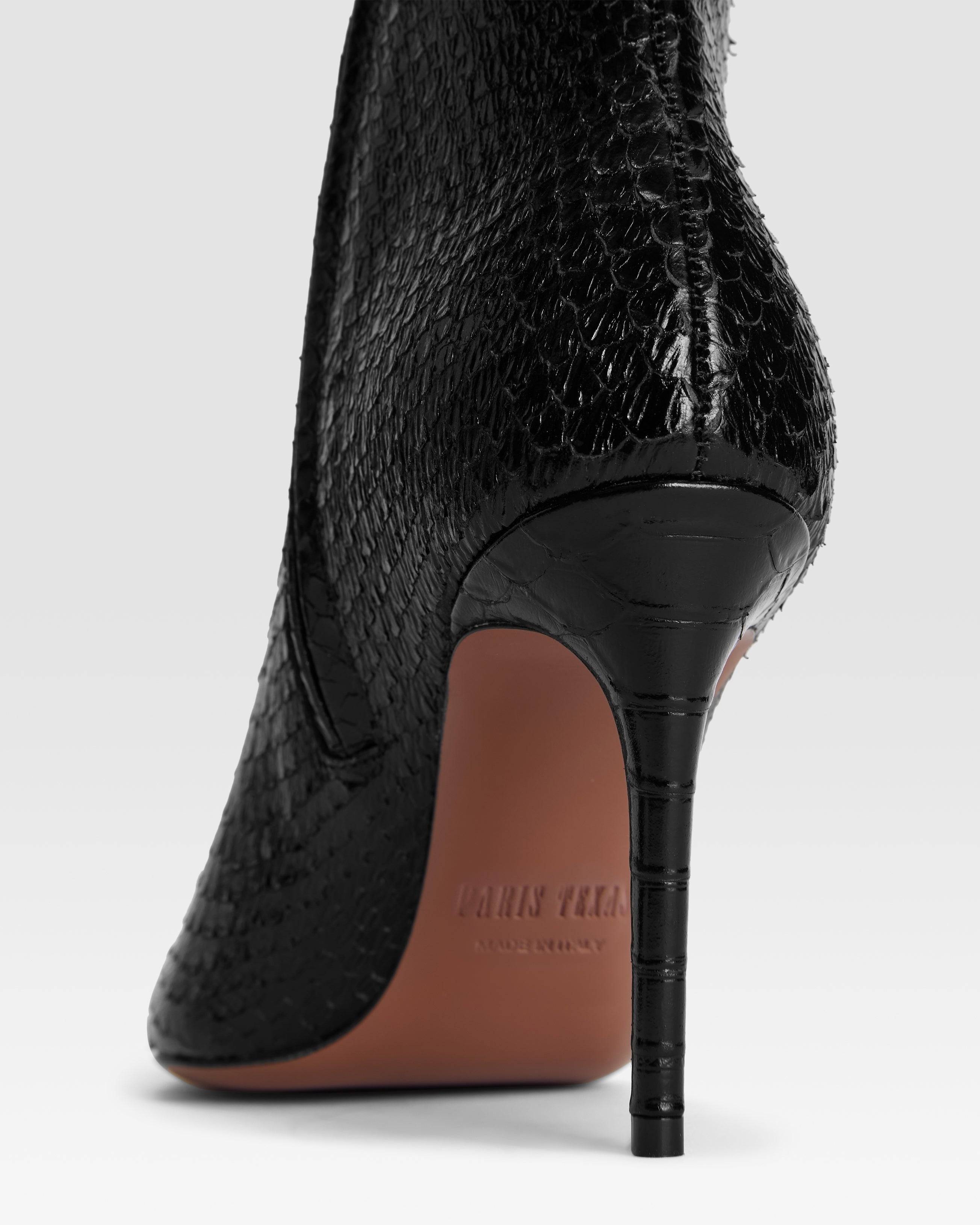 Botines de piel con estampado de serpiente de color negro