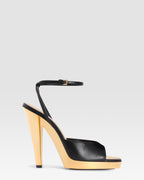 Ankle-strap sandals in shiny gold and black calf leather
