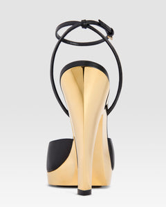 Ankle-strap sandals in shiny gold and black calf leather