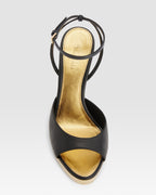 Ankle-strap sandals in shiny gold and black calf leather