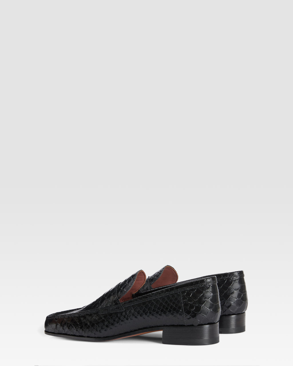 Loafers in black printed python leather