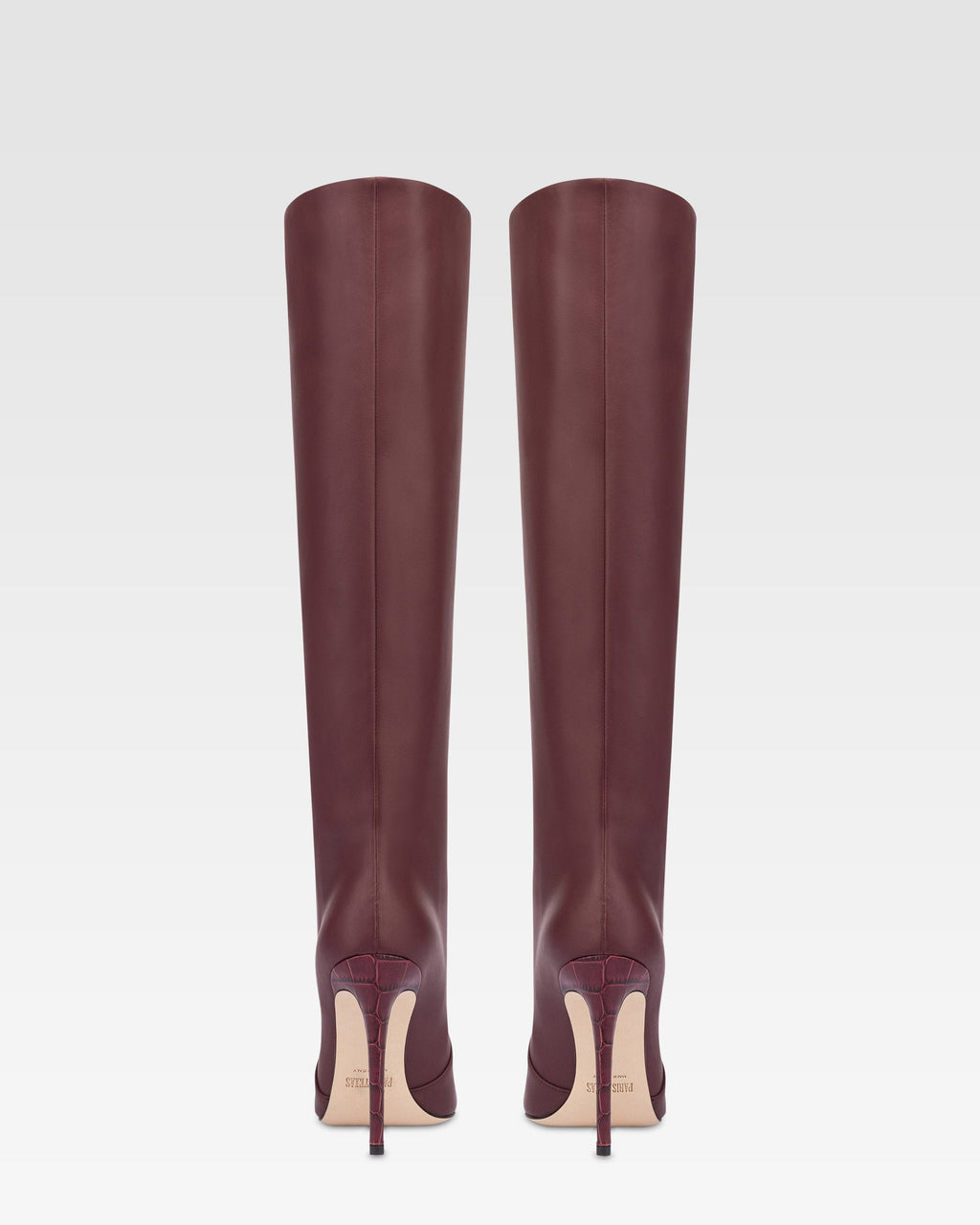 Spitz zulaufende, kniehohe Stiefel aus burgunderrotem Glattleder