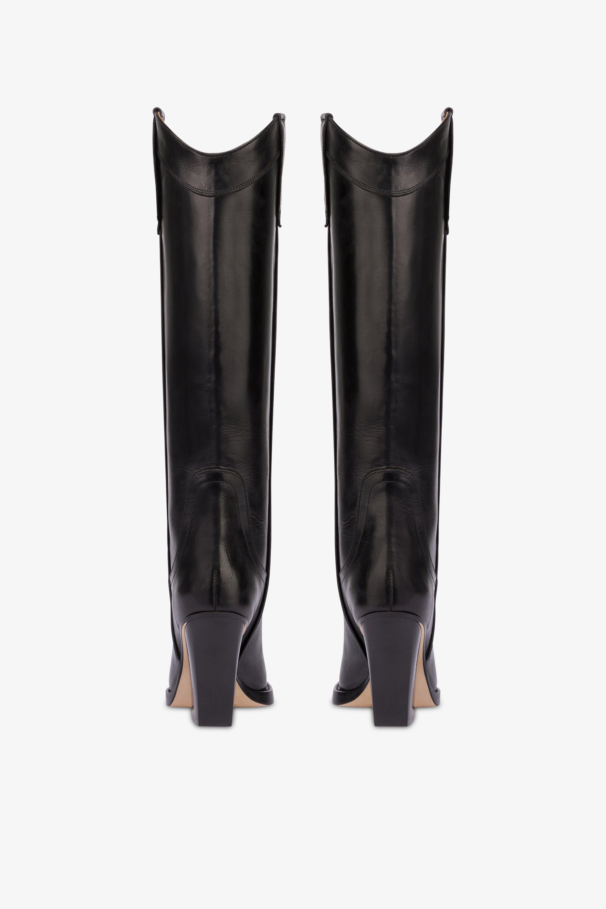 Pointed knee-high boots in black shiny vintage leather