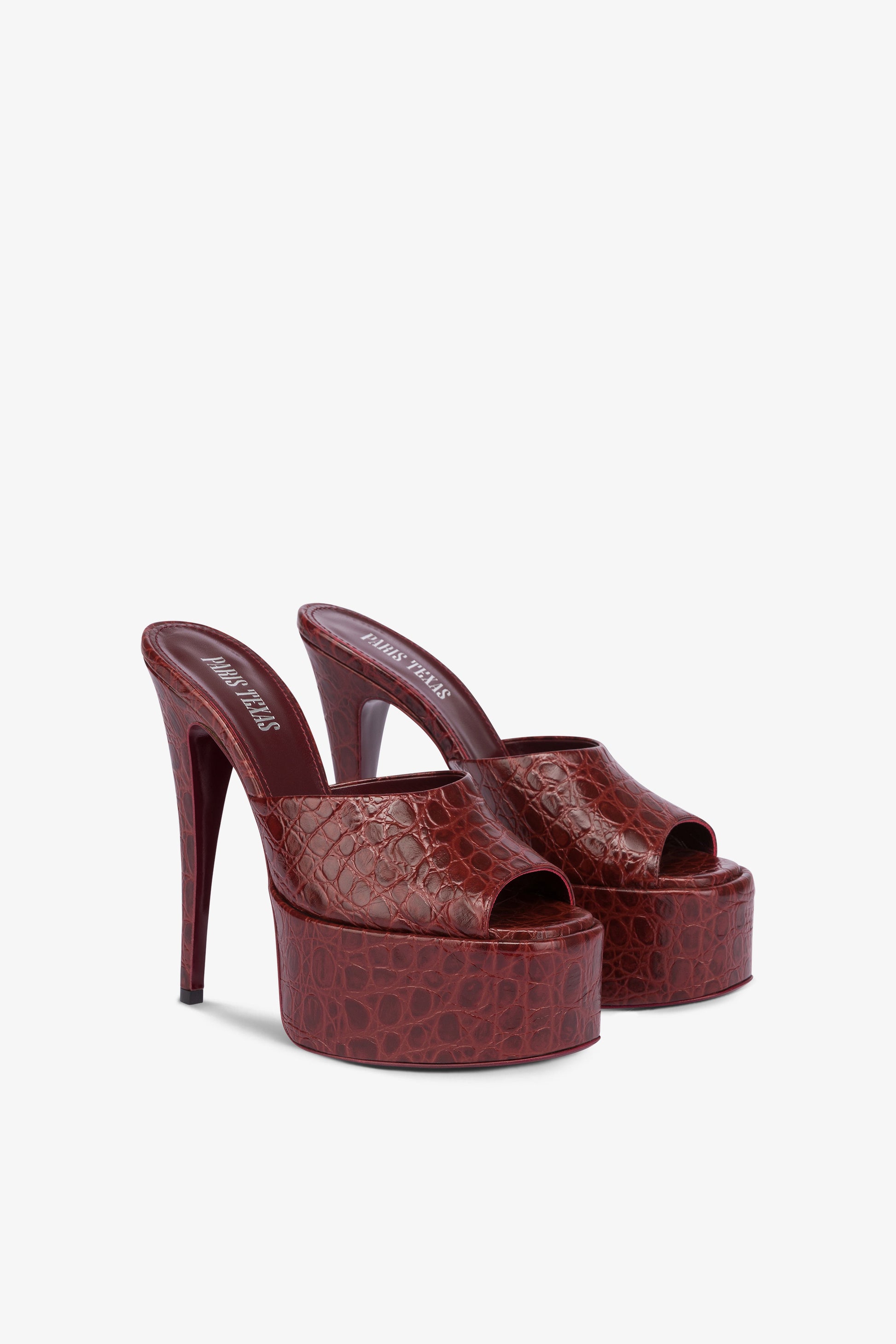 Almond-toe heeled mules in patent rouge noir leather