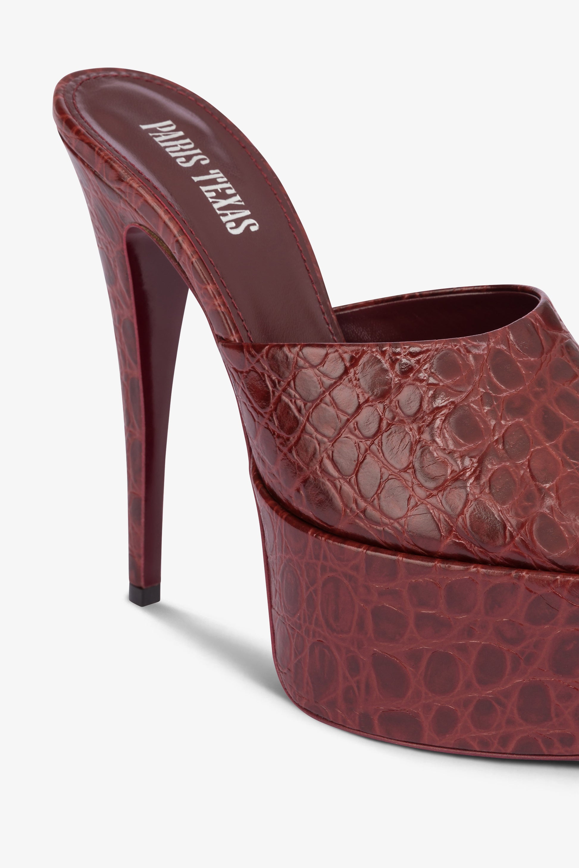 Almond-toe heeled mules in patent rouge noir leather