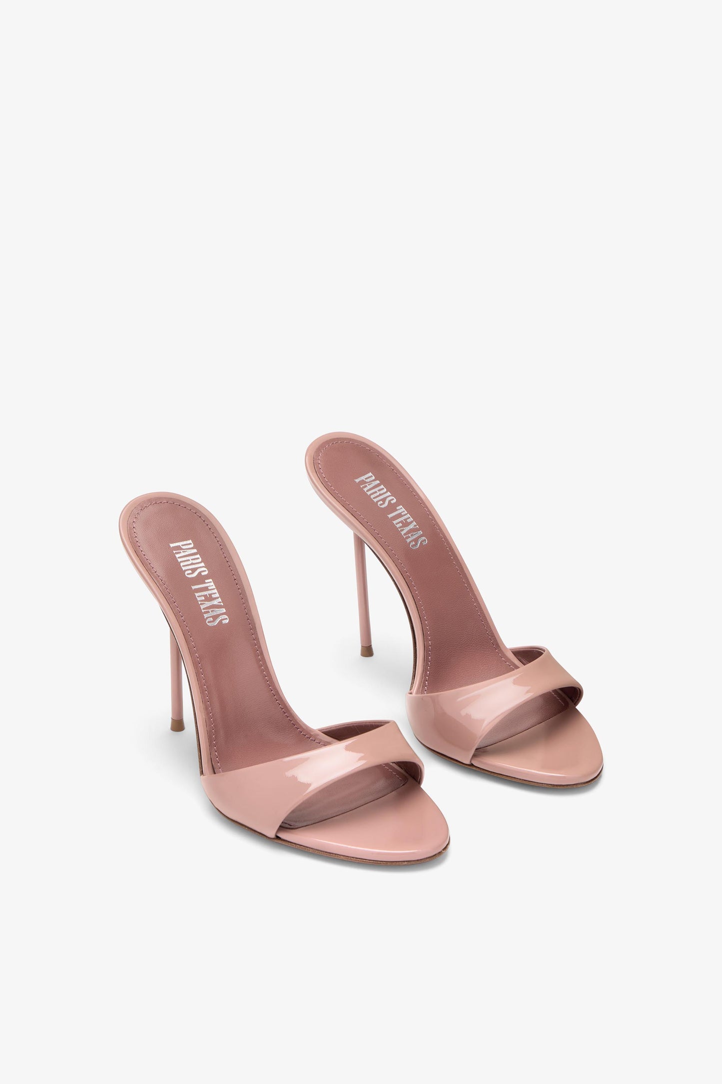 Mules in patent pink
