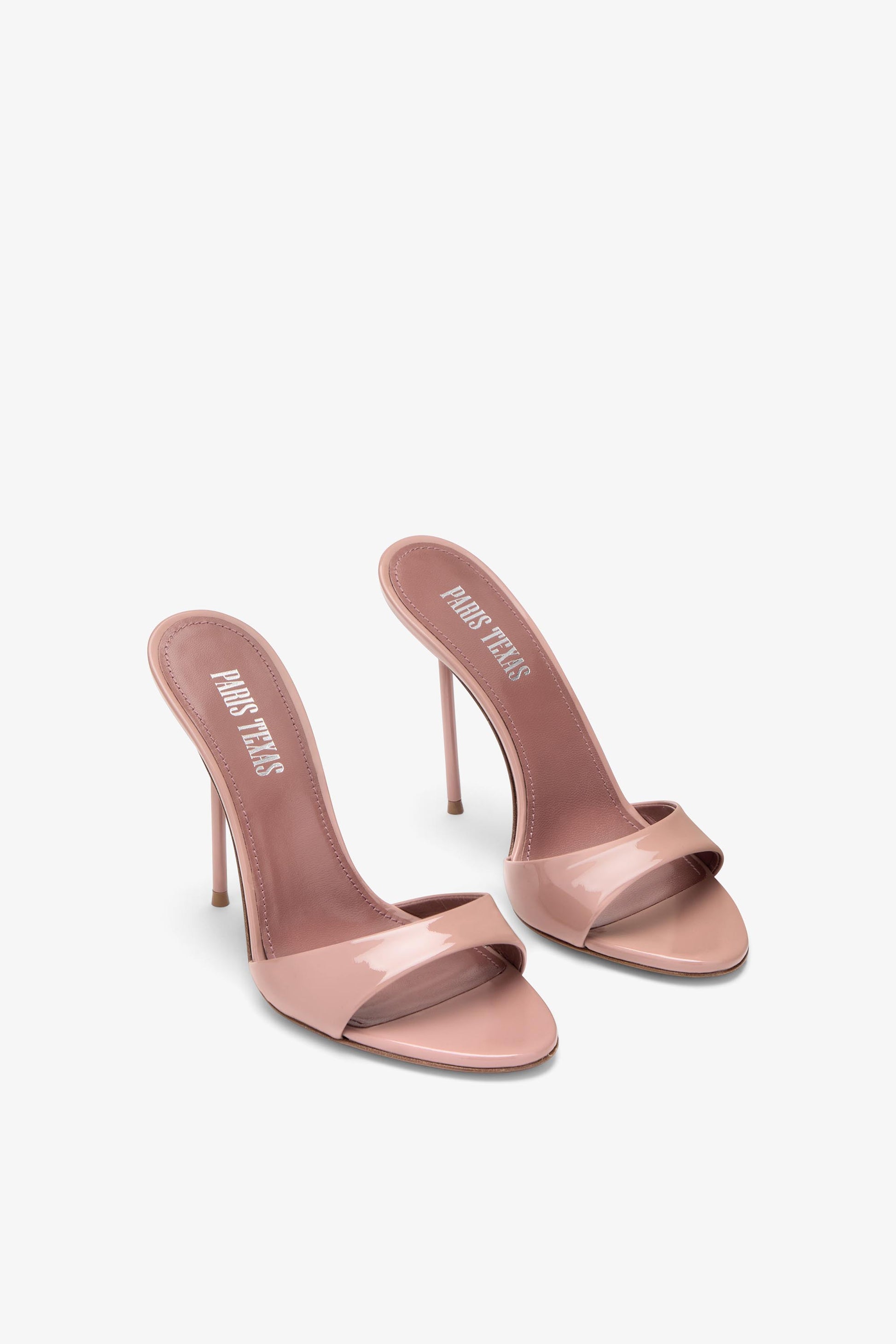 Mules in patent pink