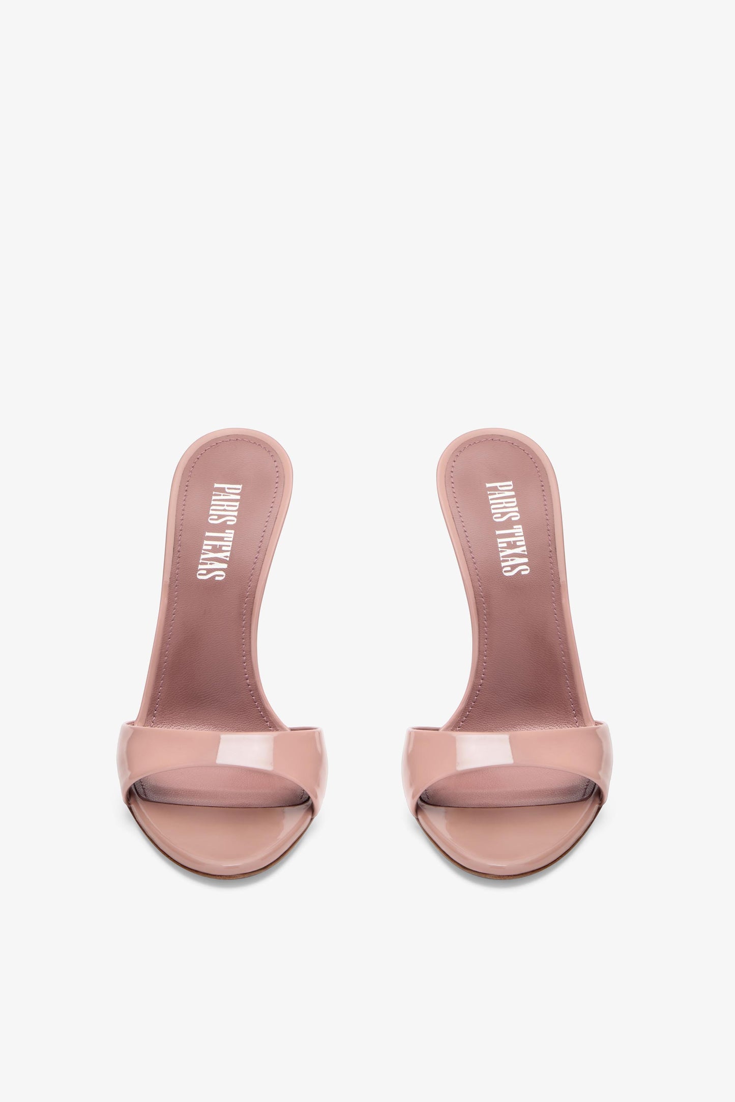 Mules in patent pink