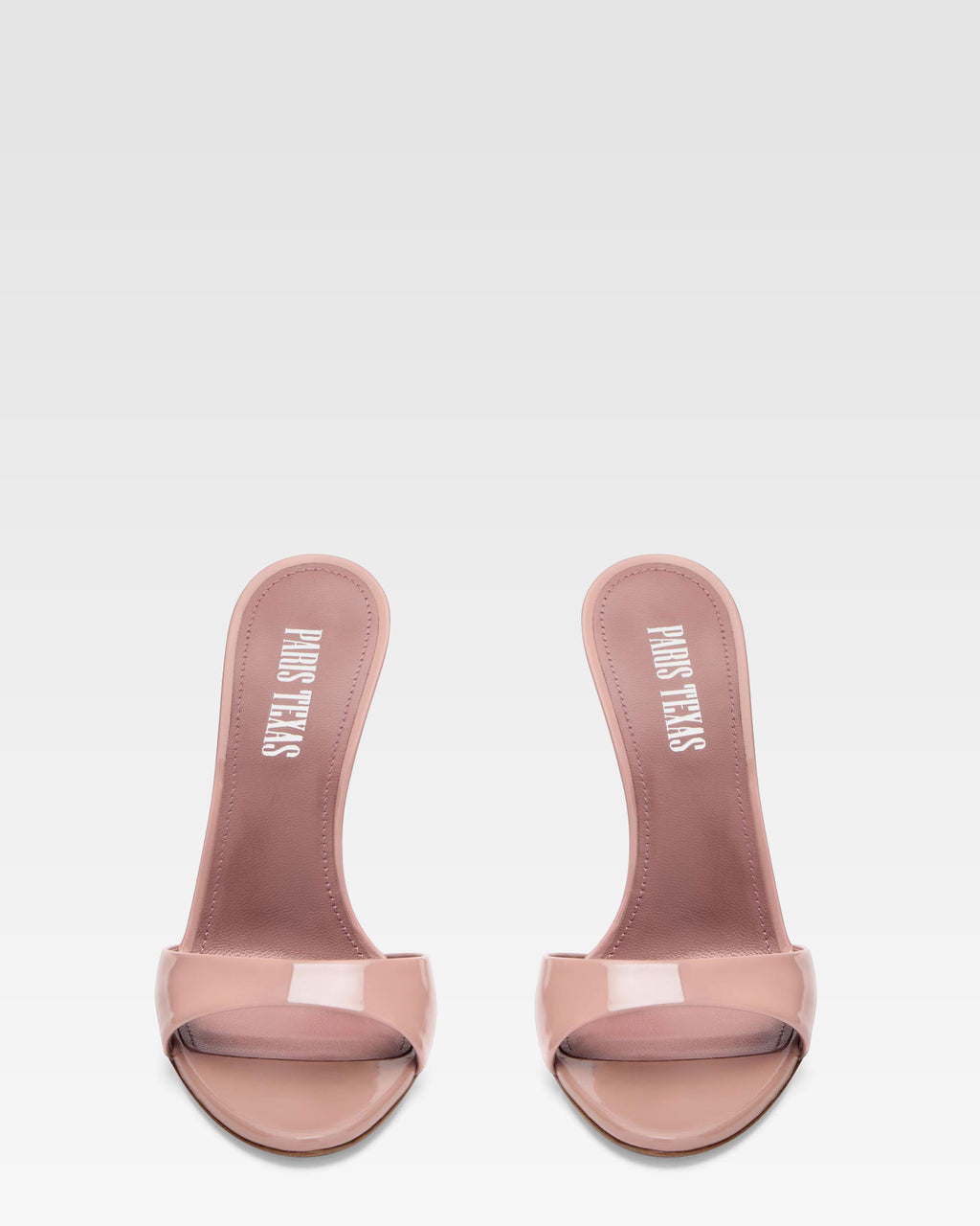 Mules in patent pink