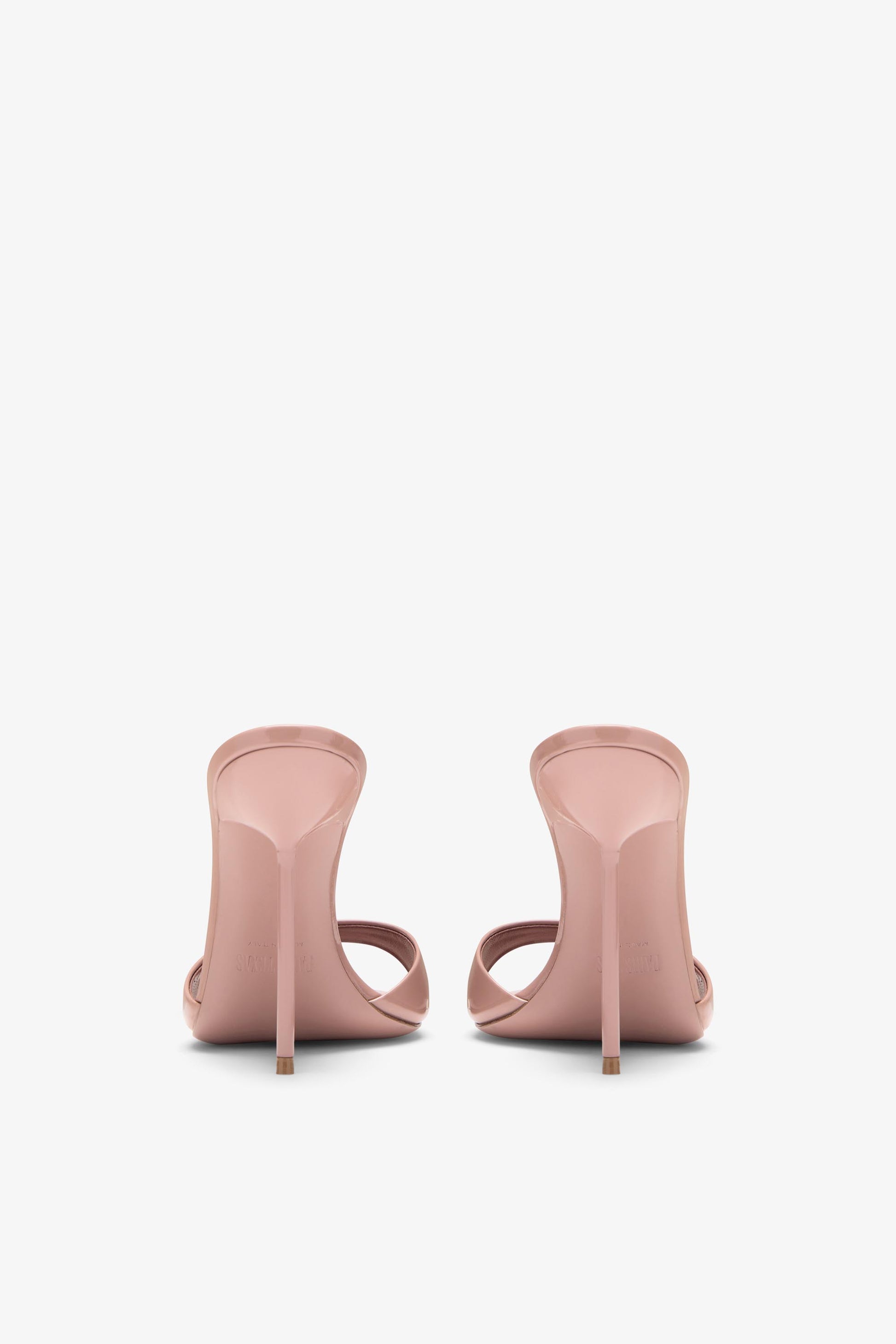 Mules in patent pink