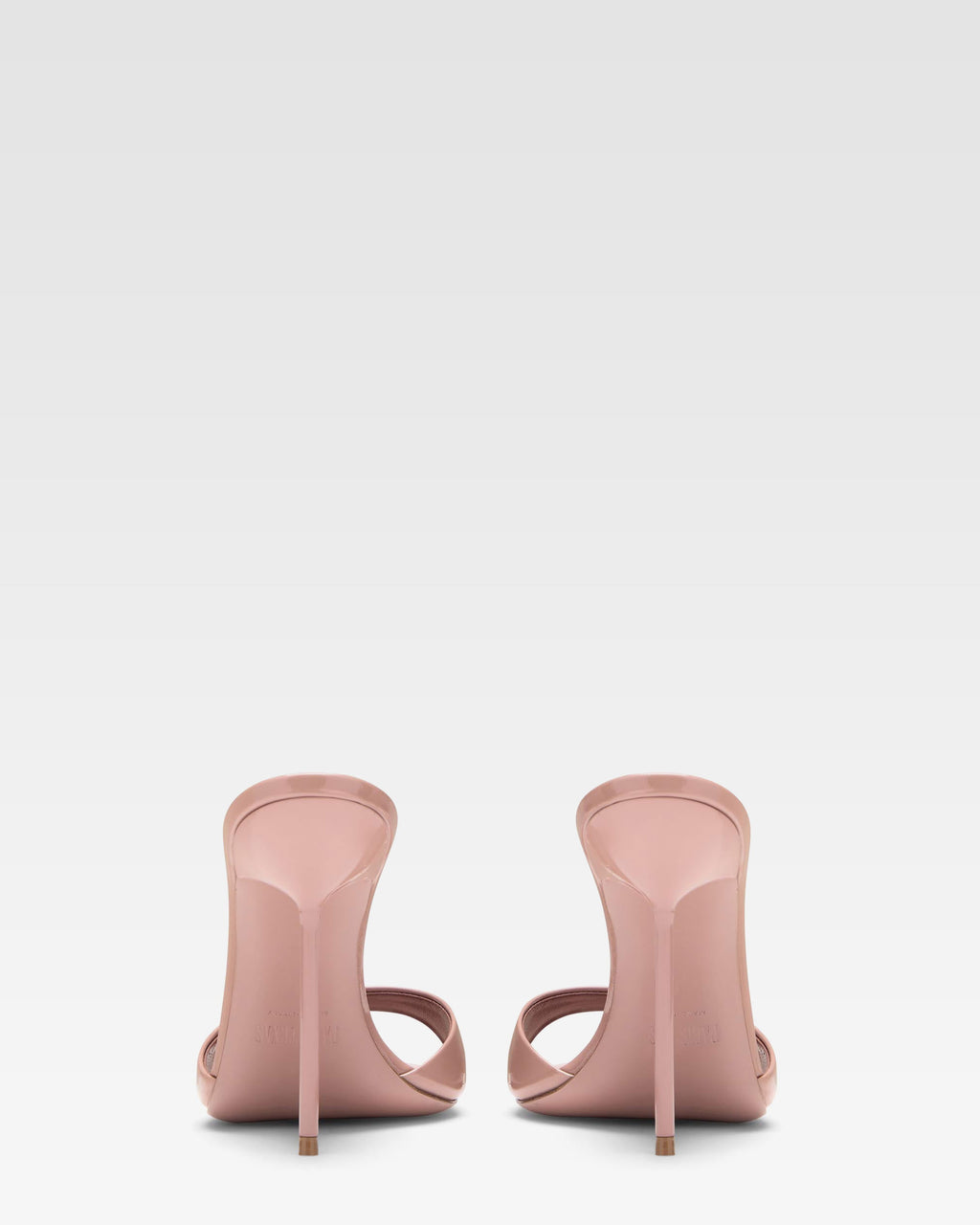 Mules in patent pink