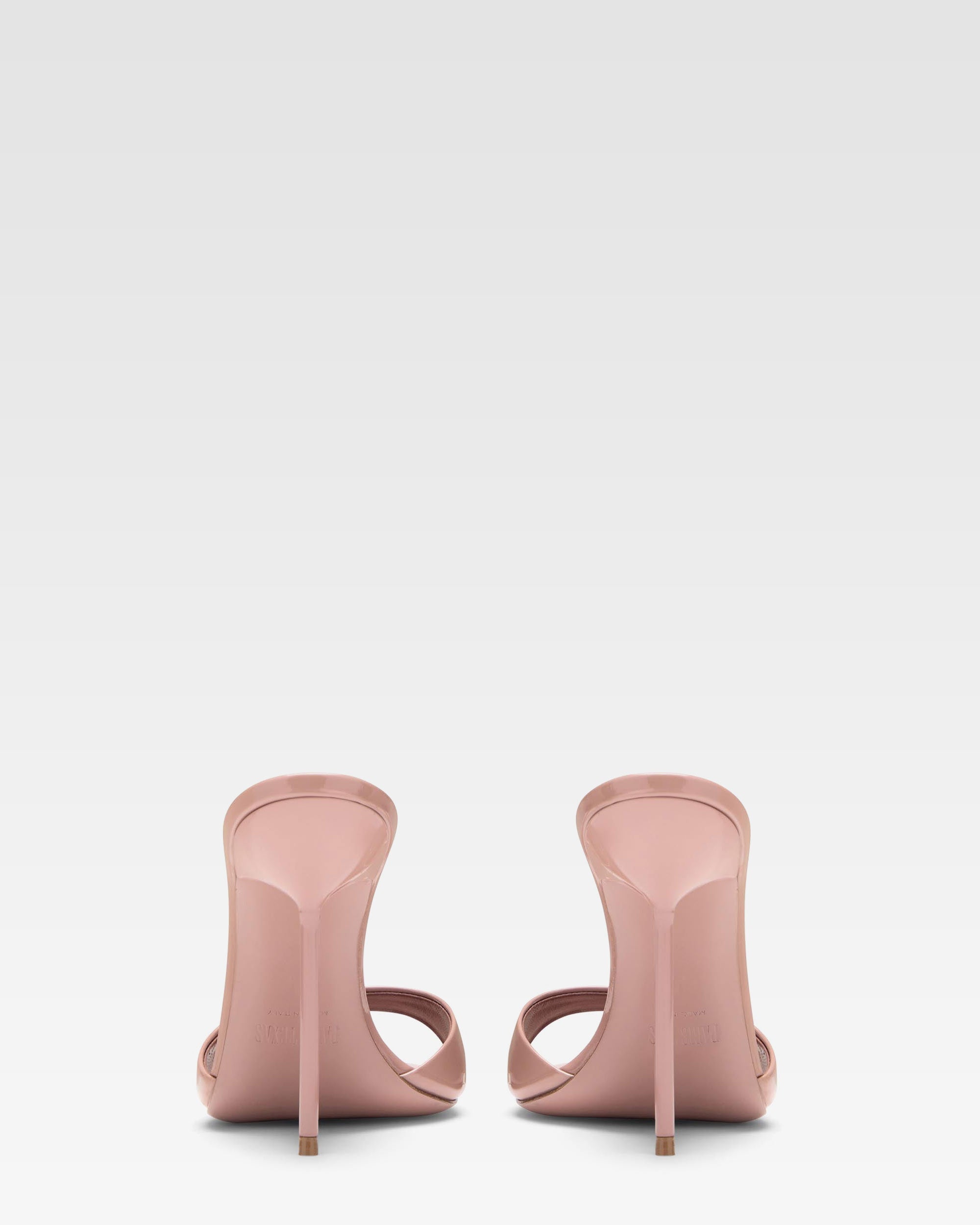 Mules in patent pink