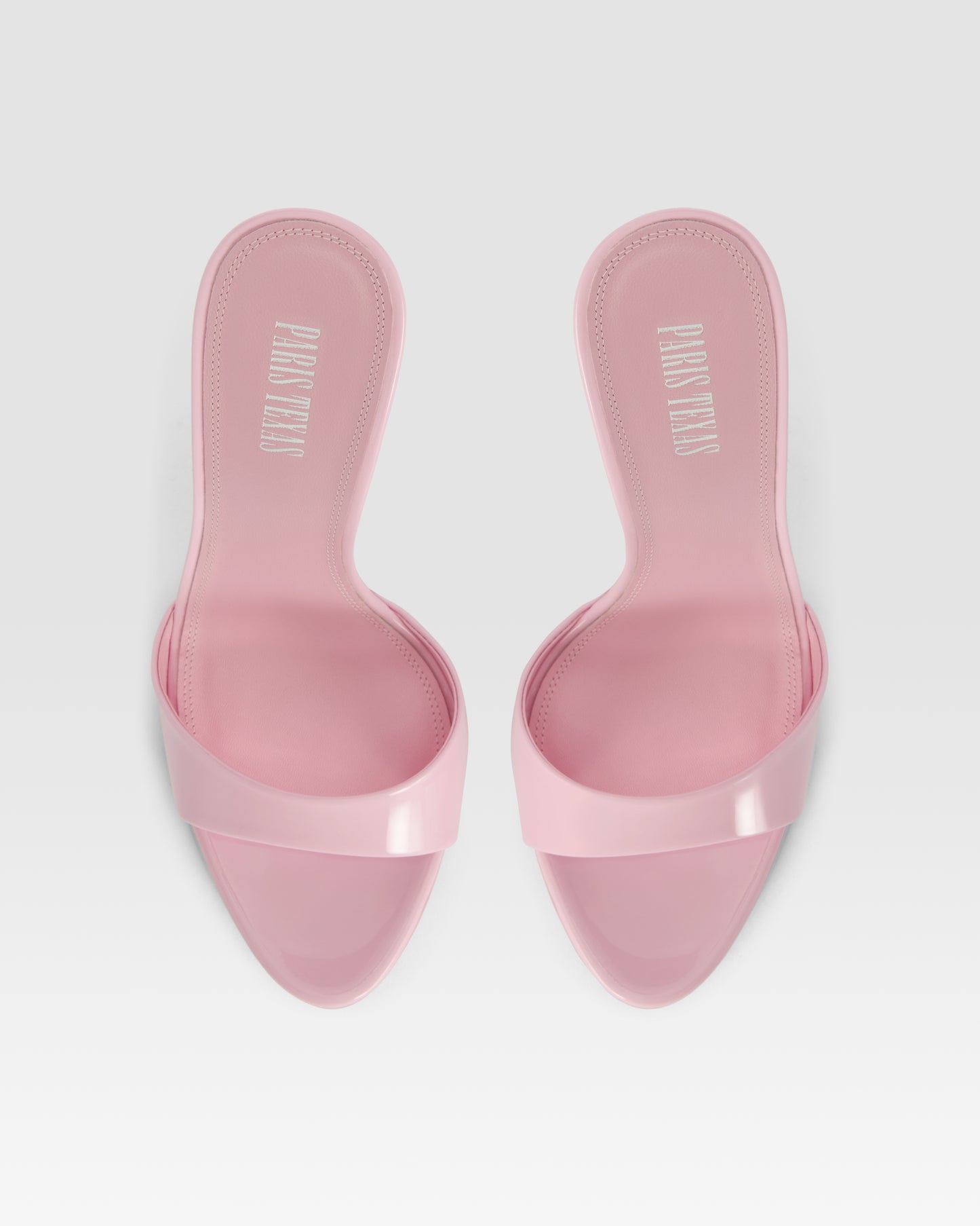 Mules in petal pink patent leather