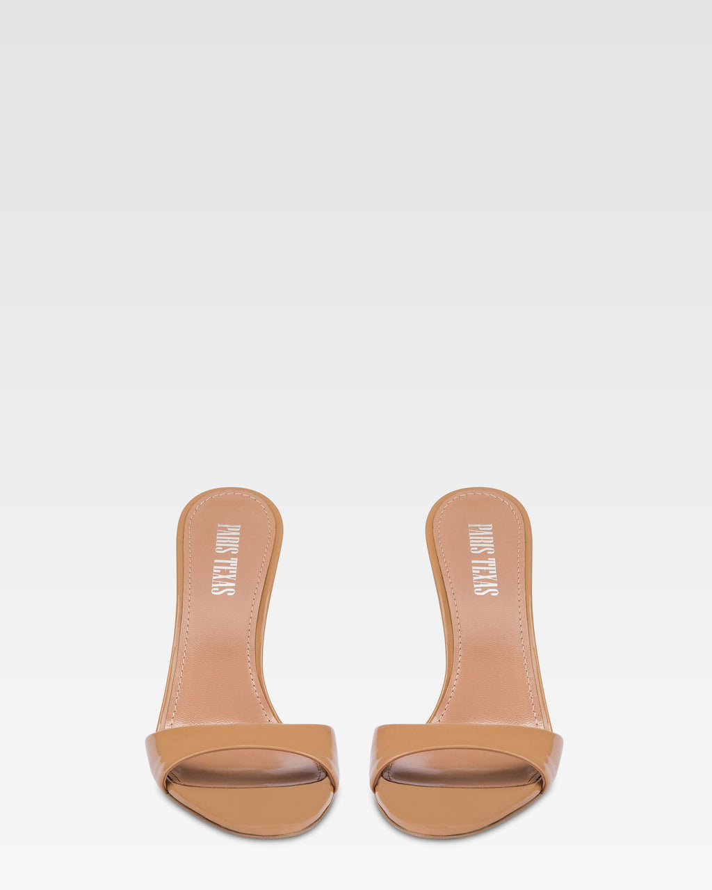 Almond-toe mules in patent caramel leather