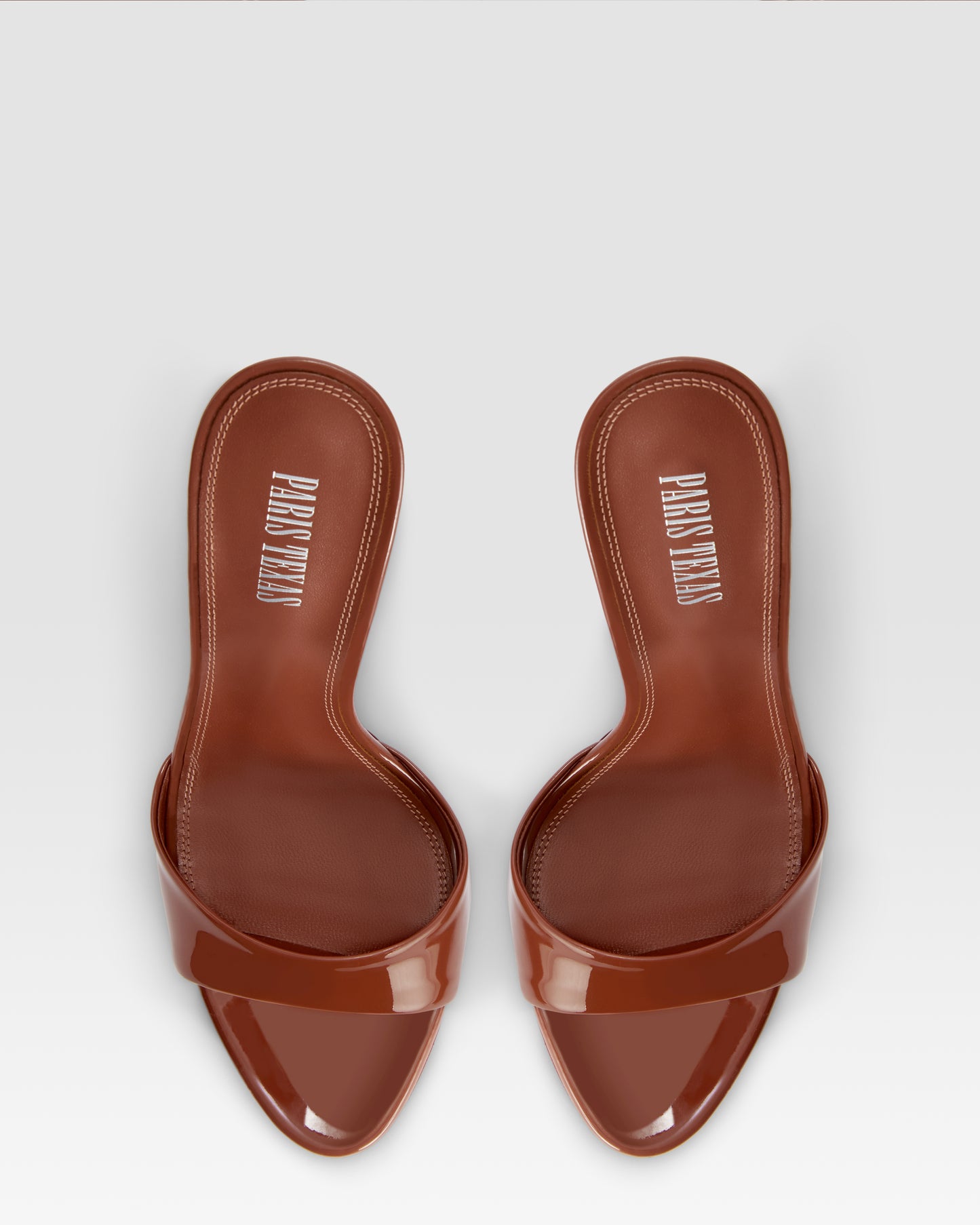 Mules in desert rose patent leather