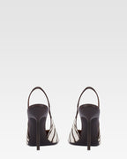 Riemchenpumps aus weissem und tiefschwarzem bedrucktem Rindsleder.